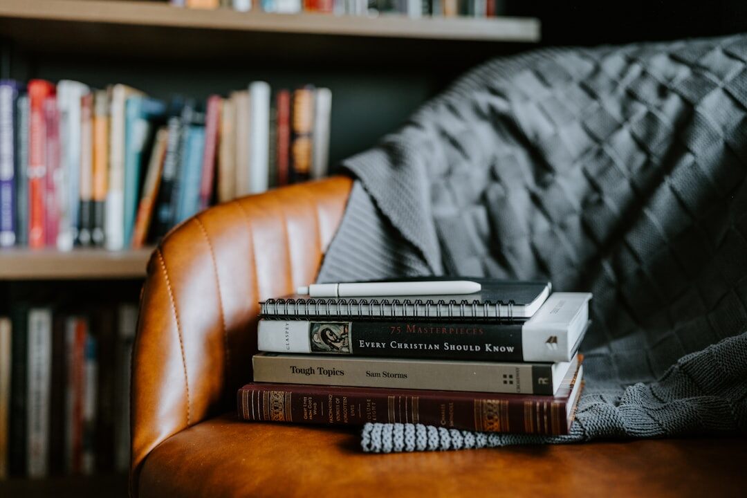 Cozy home library filled with mystery novels and a leather reading armchair