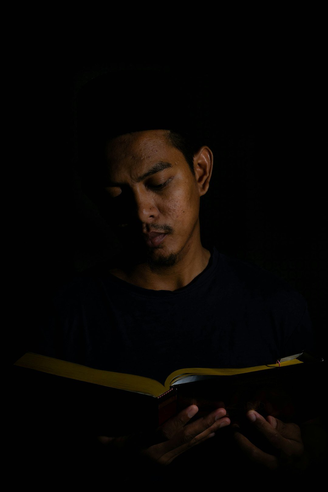 person reading thriller at night