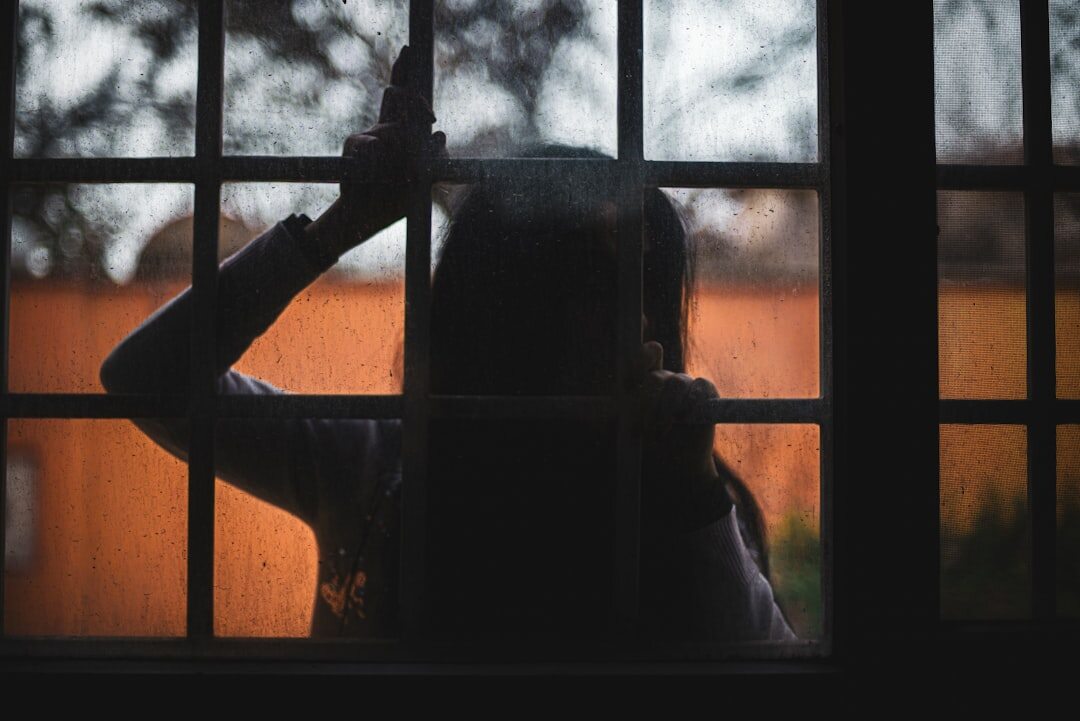 mystery writer looking through window